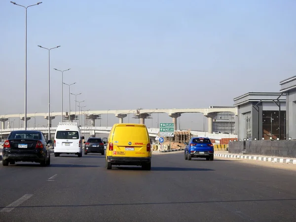 stock image Cairo, Egypt, August 31 2023: DHL truck on its way delivering a package, DHL is the global leader in the logistics industry specializing in international shipping, courier services and transportation