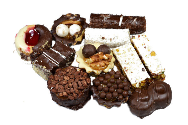 Assorted French sable cookies, Buttery, crumbly, decadent, and simple stuffed and covered with different flavors, white and brown chocolate, shredded coconuts, nuts, chunks of chocolate, shortbread