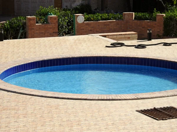 A swimming pool, swimming bath, wading paddling pool, a structure designed to hold water to enable swimming or other leisure activities, Pools can be built into the ground (in-ground pools)