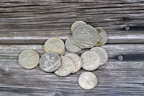 Old coins ,Iraqi money background of old coins of dinars and fractions of  dinar of different eras, old vintage retro Iraq money coin, exchange rate, economy of Iraq, vintage retro ancient money