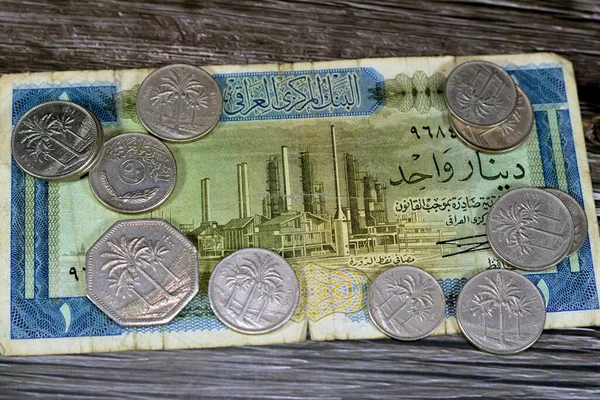 Iraqi money background of old coins and banknotes of Dinars of different eras, old vintage retro Iraq money coin and bills, exchange rate, economy status of Iraq, vintage retro ancient money
