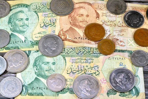 Jordanian money background of old coins and banknotes of Dinars of old times, old vintage retro Jordan money coin and bills, exchange rate, economy status of Syria, vintage retro money