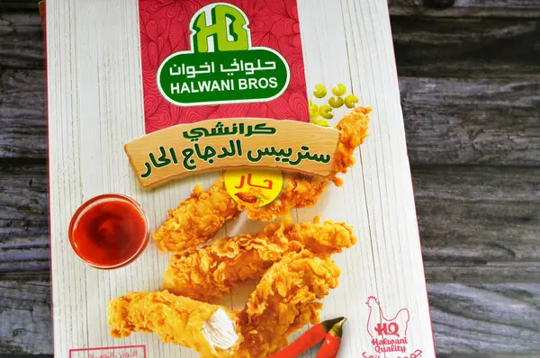 stock image Cairo, Egypt, November 1 2023: Halwani Bros Crunchy spicy chicken strips, Halwani Brothers Company is one of the pioneers in the food industry in the region of the middle east, Saudi Arabia and Egypt