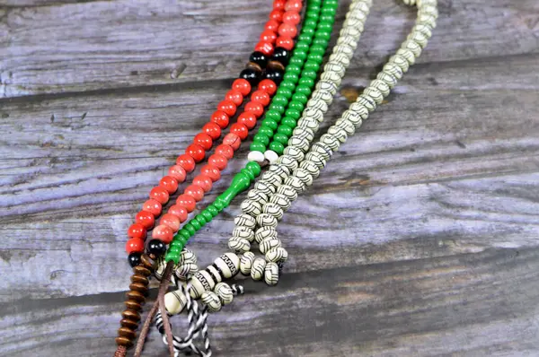 Islamic rosary with 99 rosary beads that Muslims use it to give praise to Allah using sentences to mention God like Praise and glory to Allah the greatest, selective focus