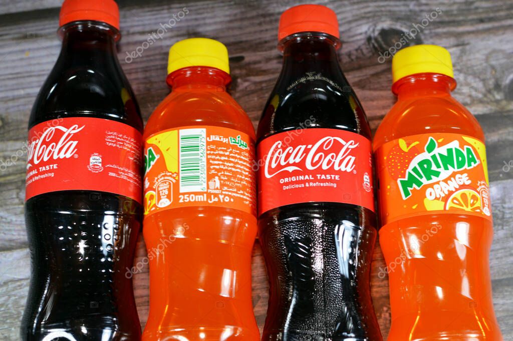 Cairo, Egypt, November 4 2023: Coca-Cola, or Coke and Mirinda plastic bottles, The Coca-Cola Company is an American multinational corporation, Mirinda , brand of soft drink originally created in Spain