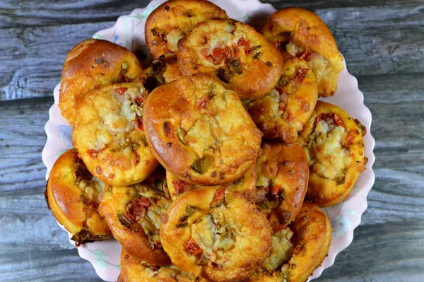 stock image Pile of mini pizzas, Pizza is a dish of Italian origin consisting of a usually round, flat base of leavened wheat-based dough topped with tomatoes, cheese and other ingredients, flatbread, Neapolitan