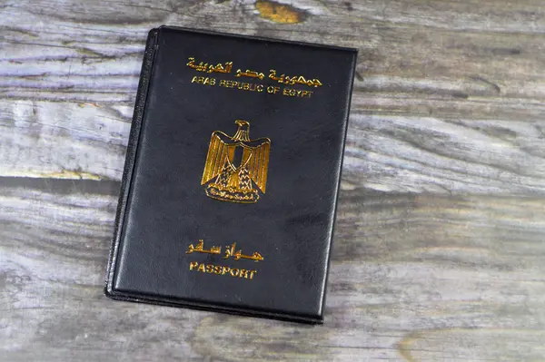 Egyptian passport black book, Translation of Arabic words (Arab republic of Egypt\'s passport) with the republican golden eagle on its cover, A black passport cover to protect the passport ID