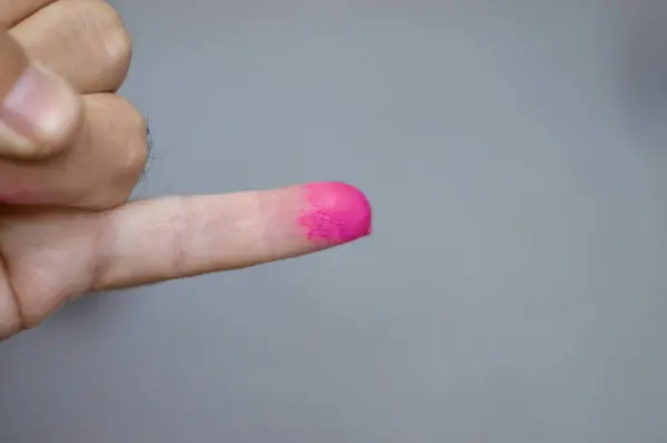 Cairo, Egypt, December 12 2023: A voter hand stained with election ink from Egypt\'s presidential elections 2024, The president of Egypt is elected for a six-year term by popular vote, selective focus