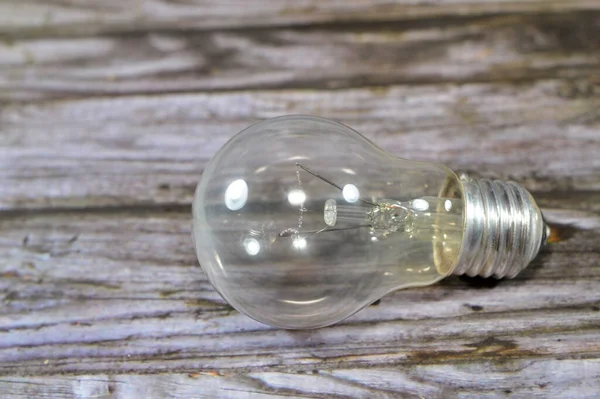 incandescent light globe bulb lamp, an electric light with a wire filament tungsten that is heated until it glows, consists of gas bulb, low pressure inert gas, Tungsten filament, wires, stem, cap