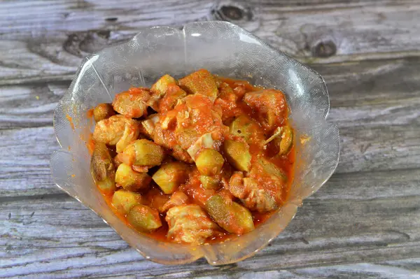 Okra cooked with beef meat pieces and tomato sauce, Bamia, bamya or Okro is Abelmoschus esculentus, known in many English-speaking countries as ladies\' fingers or ochro, Egyptian Okra dish with meat