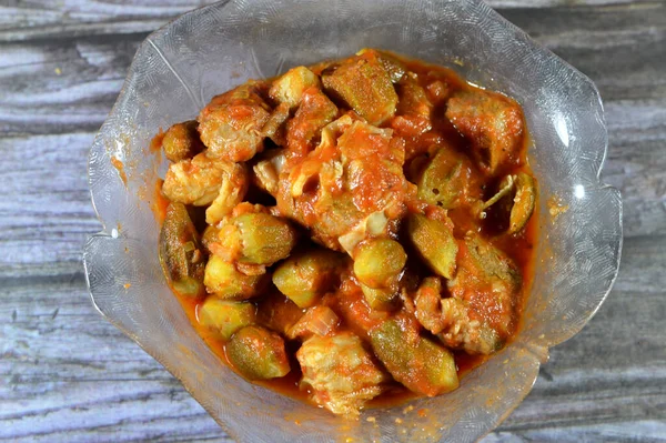 Okra cooked with beef meat pieces and tomato sauce, Bamia, bamya or Okro is Abelmoschus esculentus, known in many English-speaking countries as ladies\' fingers or ochro, Egyptian Okra dish with meat