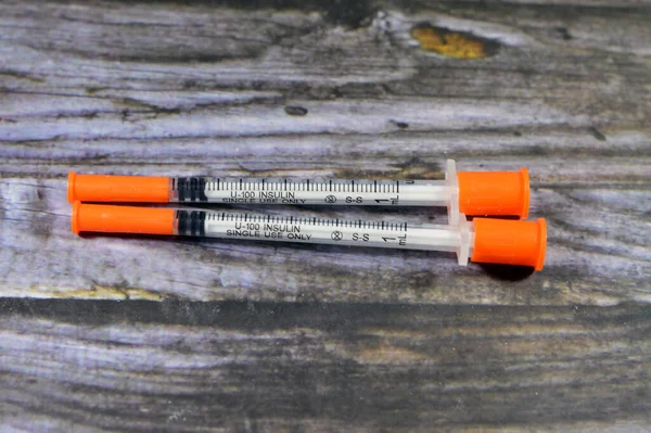 an insulin needle syringe, used to administer the Insulin dose to type 1 Diabetes mellitus ( insulin dependent) and some cases of type 2 (non insulin dependent), for subcutaneous route