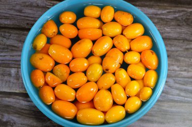 Kumkatlar, kumkatlar, küçük bir grup anjiosperm, Rutaceae ailesinde meyve taşıyan ağaçlar, altın portakal, portakala çok benzeyen yenilebilir bir meyve, Nagami kumkatları, vitamin ve minerallerle dolu.