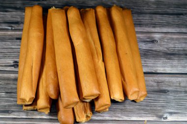 Breadsticks, also known as grissini, grissino or dipping sticks, pencil-sized sticks of crisp, dry baked bread, There is also a soft-baked breadstick version, rusk, bread crunch crackers