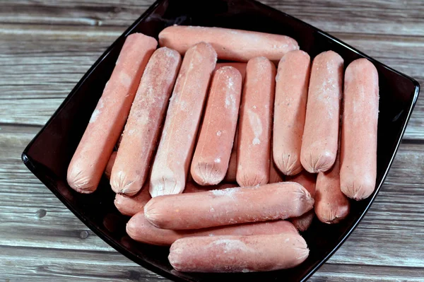 Frozen hot dog,  dish consisting of a grilled, steamed, or boiled sausage served in the slit of a partially sliced bun, hotdog is a beef sausage, called wiener (Vienna sausage) and frankfurter frank