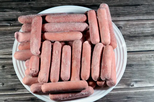 Frozen hot dog,  dish consisting of a grilled, steamed, or boiled sausage served in the slit of a partially sliced bun, hotdog is a beef sausage, called wiener (Vienna sausage) and frankfurter frank