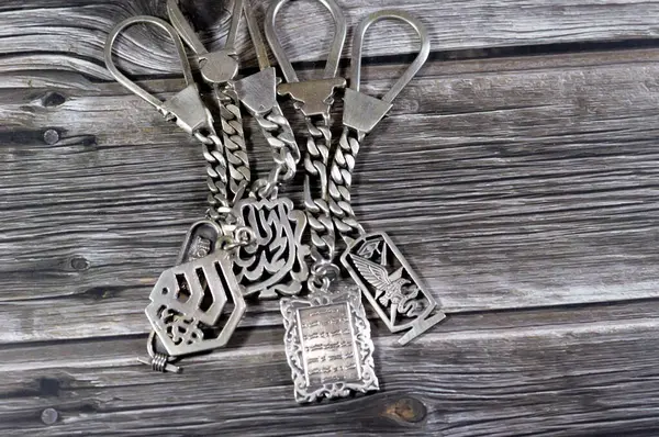 Translation of Arabic (Allah, Thanks God, Quran verses),Silver medals, Islamic medals with Quran, Allah and Pharaonic symbol medals, silver precious metal key ring medals, selective focus