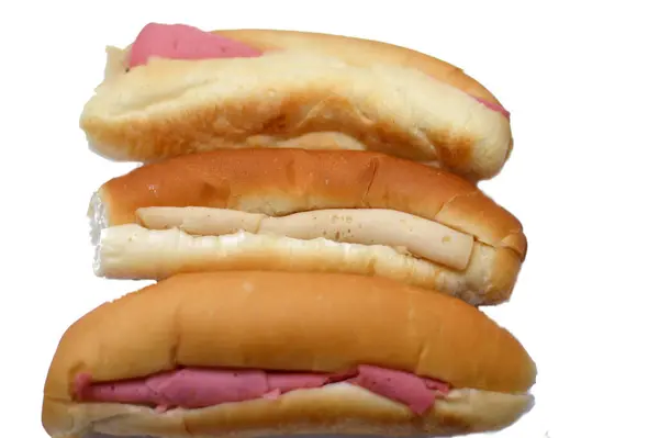 Sandwiches of Lunch meats, cold cuts, luncheon cooked sliced cold delicatessens deli beef and chicken meats in a bun bread, beef luncheon meat, fried chips sandwich, cold precooked or cured meats