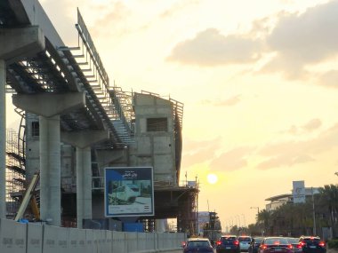 Cairo, Egypt, March 29 2024: A monorail station site that is under construction with scaffolds and crane, Cairo monorail is a two-line mono rail rapid transit system currently under construction clipart