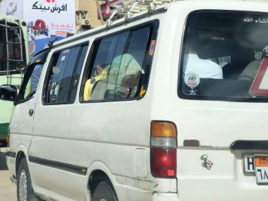 Cairo, Egypt, April 4 2024: Cairo transportation vehicles for passengers, minibus, microbus, or minicoach, a passenger-carrying motor vehicle that is designed to carry more people than a minivan clipart