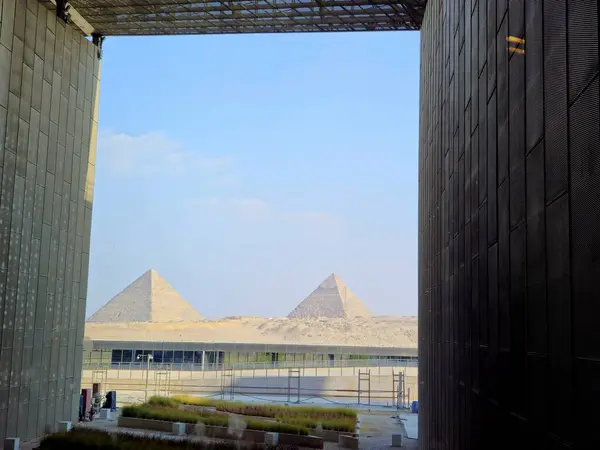 stock image Giza, Egypt, April 13 2024: Giza pyramids view from The Grand Egyptian Museum, Giza Museum, Egypt's gift to the world, the largest archaeological museum in the world, near the Giza pyramid complex
