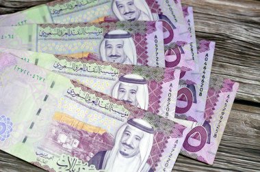 5 SAR five Saudi Arabia riyals cash money banknote bill series 1441 AH features Shaybah oil refinery in Rub' al Khali and king Salman Bin AbdulAziz Al Saud, exchange rate and money value concept clipart