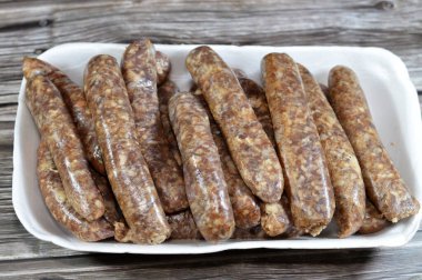 Middle Eastern raw fresh beef sausage, Egyptian sausages. it is a dry, spiced sausage either beef or lamb consumed in Middle East, uncooked meat ready to be cooked in different Eastern cuisines clipart