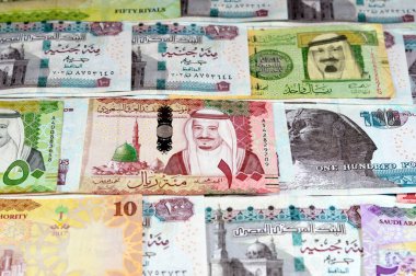 Pound and Riyal, Saudi Arabia money banknotes bill of different value riyals of King Salman Bin AbdulAziz Al Saud era and Egyptian pounds notes, Saudi and Egypt money exchange rate and economy status clipart
