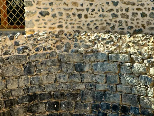 stock image Al Ghars well, a historical site linked to prophet Muhammed peace be upon him, lined with basalt stones, surrounded by building foundations, near Quba mosque, Prophet was said to have drunk from it