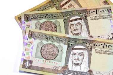 The obverse side of an old Saudi Arabia banknote bill, one 1 Riyal SAR features Fahd bin Abdulaziz Al Saud, Custodian of the Two Holy Mosques and the King of Saudi Arabia from 1982 to 2005 clipart