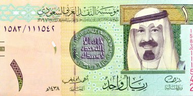 1 SAR 1 Suudi Arabistan riyal banknotunun ters tarafının büyük bir kısmında kral Abdullah Bin AbdulAziz ve 1. İslami para, eski Suudi antika para, riyaller banknotları yer alıyor.