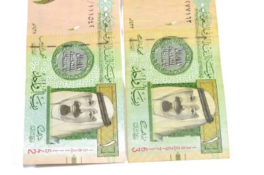 The Obverse side of 1 SAR one Saudi Arabian riyal banknote features king Abdullah Bin AbdulAziz, and the 1st Islamic coin, old ancient retro vintage Saudi money, riyals banknote money concept clipart