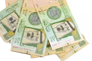 1 SAR 'ın Obverse tarafında bir Suudi Arabistan riyal banknotunda Kral Abdullah Bin AbdulAziz ve 1. İslami sikke, eski eski Suudi parası, riyaller para kavramını destekliyor.