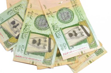 The Obverse side of 1 SAR one Saudi Arabian riyal banknote features king Abdullah Bin AbdulAziz, and the 1st Islamic coin, old ancient retro vintage Saudi money, riyals banknote money concept clipart