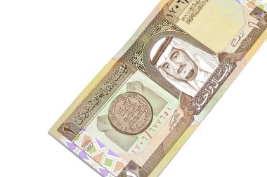 The obverse side of an old Saudi Arabia banknote bill, one 1 Riyal SAR features Fahd bin Abdulaziz Al Saud, Custodian of the Two Holy Mosques and the King of Saudi Arabia from 1982 to 2005 clipart