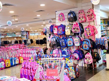 Giza, Egypt, September 16 2024: lots of backpacks school bags in a store, back to school and the school supplies, education and students concept, the bag is fabric sack carried on one's back clipart