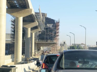 Cairo, Egypt, September 24 2024: monorail station site that is under construction with scaffolds and crane, Cairo monorail is a two-line mono rail rapid transit system currently under construction clipart