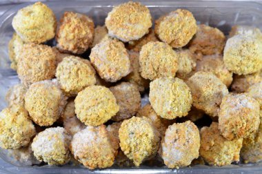 Frozen pre-fried Falafel, a deep-fried ball or patty-shaped fritter of Egyptian origin, made from broad beans, ground chickpeas, or both, Middle Eastern cuisine, popular street food in Arab countries clipart