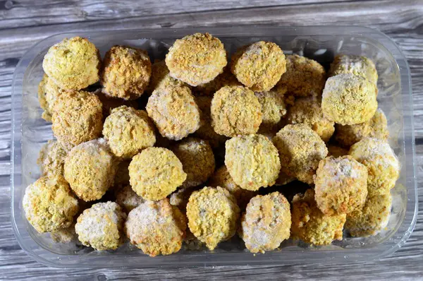 Stock image Frozen pre-fried Falafel, a deep-fried ball or patty-shaped fritter of Egyptian origin, made from broad beans, ground chickpeas, or both, Middle Eastern cuisine, popular street food in Arab countries