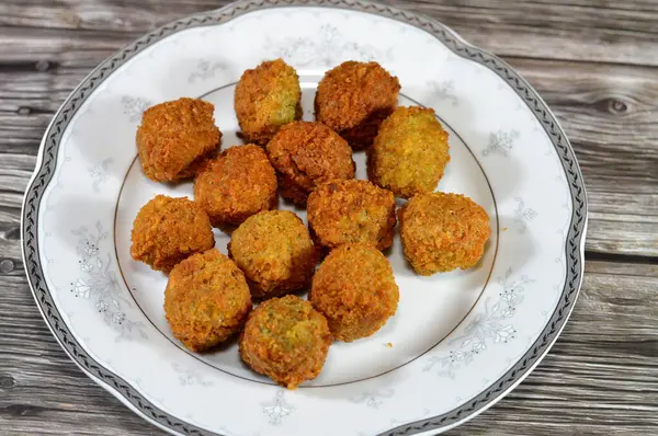 stock image Fried chickpeas Falafel, a deep-fried ball or patty-shaped fritter of Egyptian origin, made from broad beans, ground chickpeas, or both, Middle Eastern cuisine, popular street food in Arab countries