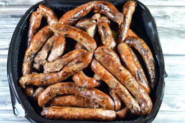 Grilled Middle Eastern beef sausage, Egyptian sausages, it is a dry, spiced sausage either beef or lamb consumed in Middle East, barbecued meat sausages on a grill served in a disposable plate