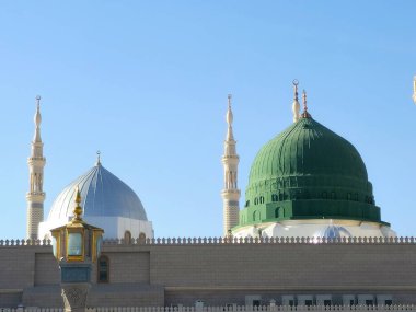 The Minaret and the Green dome of The Prophet's Mosque or Al Masjid Al Nabawi, a major site of pilgrimage that falls under the purview of the Custodian of the Two Holy Mosques clipart