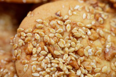 Barazek or barazeq, Syrian cookie with sesame as main ingredient, with pieces of peanuts, sugar and honey, made of flour, butter, sugar, sesame, sweet, buttery, nutty flavor, crisp and brittle texture clipart