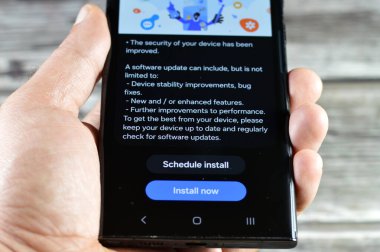 Cairo, Egypt, October 4 2024: Samsung software update for Samsung Flagship cellular phones, Galaxy AI One UI upgrade, with device stability improvements, bug fixes, enhanced features, S23 ultra phone clipart