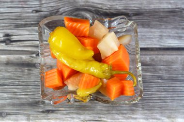 Egyptian pickles marinated vegetables (Torshi) or mixed pickled vegetables of sliced, carrots, beets, turnips, green peppers and salt, Egyptian appetizer Arabian cuisine, selective focus clipart