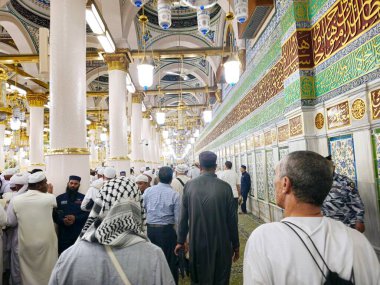 Medina, Saudi Arabia, June 28 2024: At the place of Al Rawda Al Sharefa, The Grave of Prophet Muhammed peace be upon him, with the 1st two caliphs after him Abu Bakr al-Siddiq and Omar Ibn El Khattab clipart