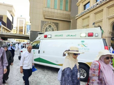 Mecca, Saudi Arabia, June 23 2024: an ambulance for emergency calls of the ministry of health of Saudi Arabia in Makkah region during pilgrimage season, ambulance for pilgrims in Mecca city clipart