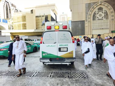 Mecca, Saudi Arabia, June 23 2024: an ambulance for emergency calls of the ministry of health of Saudi Arabia in Makkah region during pilgrimage season, ambulance for pilgrims in Mecca city clipart