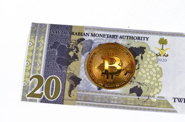 Saudi Arabia riyals banknote with Bitcoin physical golden coin, BTC the 1st decentralized cryptocurrency, nodes in P2P bitcoin network verify transactions by cryptography and recorded in blockchain clipart