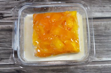 Pieces of fresh mango fruit on top of Tres leches cake, pan Tres leches, a sponge cake soaked in three kinds of milk, evaporated, condensed and whole milk, whipped cream, light cake with air bubbles clipart